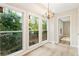 Sun room with a chandelier and lots of natural light at 4315 Orchard Park Ct, Stone Mountain, GA 30083
