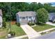 Aerial view of two-story house with driveway and landscaped yard at 138 Stargaze Rdg, Canton, GA 30114