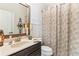 Charming bathroom with dark vanity, decorative shower curtain, and updated fixtures at 138 Stargaze Rdg, Canton, GA 30114