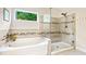 Bathroom with soaking tub and a large walk-in shower with glass enclosure at 138 Stargaze Rdg, Canton, GA 30114