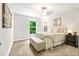 Well-lit bedroom with a comfortable bed and a view of the backyard at 138 Stargaze Rdg, Canton, GA 30114