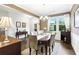 Bright dining room with hardwood floors and elegant chandelier at 138 Stargaze Rdg, Canton, GA 30114