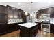 Modern kitchen with dark cabinetry, stainless steel appliances, and an island at 138 Stargaze Rdg, Canton, GA 30114