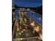 Night view of a courtyard with lights and trees at 5015 Renvyle Dr. (Lot 12) Dr, Atlanta, GA 30339