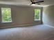 Large bedroom with carpet floors and two windows for plenty of natural light at 5015 Renvyle Dr. (Lot 12) Dr, Atlanta, GA 30339