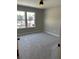 Bright bedroom with neutral walls and carpet at 5015 Renvyle Dr. (Lot 12) Dr, Atlanta, GA 30339