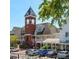 Brick building with a clock tower and landscaping at 5015 Renvyle Dr. (Lot 12) Dr, Atlanta, GA 30339