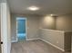 Open hallway space with neutral carpet and walls; a simple, clean transition area within the home at 5015 Renvyle Dr. (Lot 12) Dr, Atlanta, GA 30339