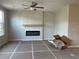 Living room with a modern electric fireplace and mantle, creating a cozy and inviting atmosphere at 5015 Renvyle Dr. (Lot 12) Dr, Atlanta, GA 30339