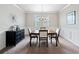 Formal dining room with neutral colors, chandelier, and modern decor at 5410 Whisper Ct, Cumming, GA 30028