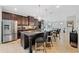 Modern kitchen features a large island with seating and stainless steel appliances at 5410 Whisper Ct, Cumming, GA 30028