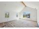 A bedroom showcasing a vaulted ceiling and multiple windows providing abundant natural light at 235 River Valley Court Lot 4 Ct, Atlanta, GA 30328