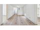 Long hallway with clean lines, recessed lighting, and doorways leading to other rooms at 235 River Valley Court Lot 4 Ct, Atlanta, GA 30328