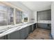 Bright kitchenette area featuring gray cabinets, white countertops, and large windows at 235 River Valley Court Lot 4 Ct, Atlanta, GA 30328