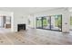 Spacious living room with fireplace, large sliding glass doors and ample natural light at 235 River Valley Court Lot 4 Ct, Atlanta, GA 30328