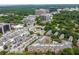 Overhead view of the apartment buildings with pools, parking, and manicured trees at 1735 Peachtree Ne St # 321, Atlanta, GA 30309
