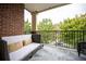 Inviting balcony featuring cozy seating with a courtyard view at 1735 Peachtree Ne St # 321, Atlanta, GA 30309