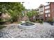 Community courtyard with benches and central water fountain in a landscaped setting at 1735 Peachtree Ne St # 321, Atlanta, GA 30309
