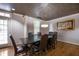 Dining room with a long dark table, and textured ceiling at 1735 Peachtree Ne St # 321, Atlanta, GA 30309