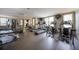 Well equipped exercise room with windows and mounted TVs at 1735 Peachtree Ne St # 321, Atlanta, GA 30309