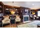 Living room featuring a fireplace, built in shelves, and decorative wood trim at 1735 Peachtree Ne St # 321, Atlanta, GA 30309