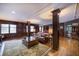 Lounge area featuring paneled walls, hardwood floors and comfortable seating at 1735 Peachtree Ne St # 321, Atlanta, GA 30309