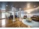 Sitting area with hardwood floors, textured ceiling and supporting columns at 1735 Peachtree Ne St # 321, Atlanta, GA 30309