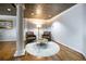 Sitting area with hardwood floors, textured ceiling and supporting columns at 1735 Peachtree Ne St # 321, Atlanta, GA 30309