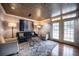 Sitting area with blue sofa, hardwood floors and textured ceiling at 1735 Peachtree Ne St # 321, Atlanta, GA 30309