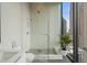 Large walk-in shower with glass enclosure and modern tile at 40 12Th Ne St # 1903, Atlanta, GA 30309