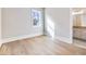 This bedroom has wood floors and offers great natural light from the window at 216 Ewing Way, Dacula, GA 30019