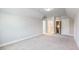 Spacious bedroom features neutral carpet and trim, with access to other rooms at 216 Ewing Way, Dacula, GA 30019