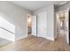 Spacious bedroom features hardwood floors and entryways to adjacent rooms and bath at 216 Ewing Way, Dacula, GA 30019