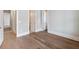 This home offers a naturally lit bedroom with hardwood floors and entryways to adjacent rooms at 216 Ewing Way, Dacula, GA 30019