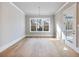 Sunlit dining room with a large window and access to the outdoor deck at 216 Ewing Way, Dacula, GA 30019