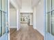 Bright, open entryway with hardwood floors leading into a spacious living area at 216 Ewing Way, Dacula, GA 30019