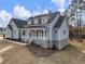 Charming two-story home with a welcoming front porch and stone accents at 216 Ewing Way, Dacula, GA 30019
