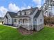 Charming home featuring a stone foundation, blue siding, and inviting front porch at 216 Ewing Way, Dacula, GA 30019