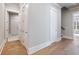 Hallway featuring hardwood floors, neutral walls, and closet space at 216 Ewing Way, Dacula, GA 30019