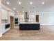 Modern kitchen with stainless steel appliances and a large center island at 216 Ewing Way, Dacula, GA 30019