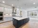 Beautiful kitchen featuring gray cabinets, a spacious island, and stainless steel appliances at 216 Ewing Way, Dacula, GA 30019