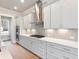 Modern kitchen with quartz countertops, stainless steel appliances and herringbone backsplash at 216 Ewing Way, Dacula, GA 30019
