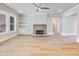 Spacious living room with a brick fireplace and natural lighting at 216 Ewing Way, Dacula, GA 30019