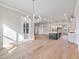 Open concept living room with kitchen and dining room. Great for entertaining and Gathering living at 216 Ewing Way, Dacula, GA 30019