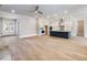 Open-concept living area with kitchen, ample hardwood floors, and natural light at 216 Ewing Way, Dacula, GA 30019