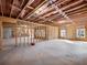 Unfinished basement with exposed beams, wood framing, and small windows at 216 Ewing Way, Dacula, GA 30019