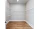 Large walk-in closet with wood floors and wire shelving at 216 Ewing Way, Dacula, GA 30019