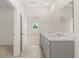 Primary bathroom showcases a dual-sink vanity with granite counters and a large mirror at 8593 Preakness Pass, Lithonia, GA 30058