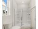 Modern bathroom featuring a glass-enclosed shower with built-in shelving and a contemporary design at 8593 Preakness Pass, Lithonia, GA 30058