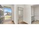 Inviting foyer with hardwood floors, a view of the front yard and bathroom, and open access to other rooms at 8593 Preakness Pass, Lithonia, GA 30058